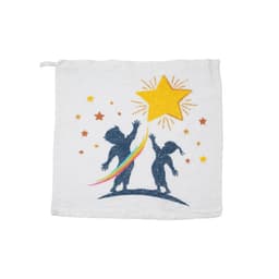A white compressed towel featuring playful silhouettes of two children reaching for a star, with a rainbow design.