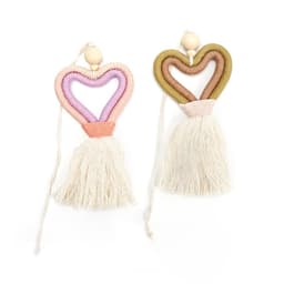 Two heart-shaped car pendants in pink, purple, and olive green with cream tassels and wooden beads.