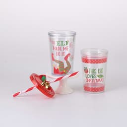 A drink tumbler set featuring two plastic cups, one red and the other clear with festive designs, and a straw lid.