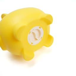 A yellow piggy bank with a round base and four short legs, featuring a logo on the bottom.