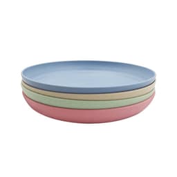 A set of four unbreakable plates in blue, green, pink, and beige, stacked neatly with a smooth surface.