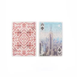 Custom PVC clear playing cards featuring a red patterned back and an illustrated Ace of Spades with a cityscape design.