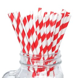 A glass jar filled with red and white striped paper drinking straws.