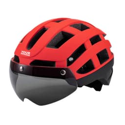 A red cycling helmet with a built-in visor and a branded logo. Features ventilation holes and a sleek design.