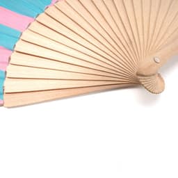 A wooden folding fan with a pink and blue patterned fabric, featuring a detailed wooden handle.