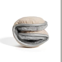 A foldable down ear warmer in beige with grey lining, featuring a quilted design and a soft interior.