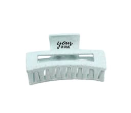 A greenish-blue wheat straw hair claw clip with a textured surface and a logo.