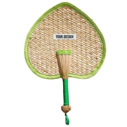 A heart-shaped woven fan in natural tones with a green trim and handle. It features a designated area for custom designs.