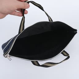 A dark blue document bag with a zipper and handles, featuring a spacious black interior.