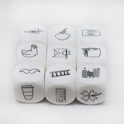 A set of nine white acrylic dice featuring various black icons, including a chicken, cloud, and buildings.