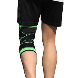 A knitted strap sports knee pad in black with green accents, positioned on a wearer's knee.
