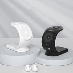 A white and a black 3-in-1 vertical wireless charger on circular bases, with a minimalist design and a logo.