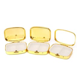 A gold metal pill box with a mirror, featuring three compartments and a reflective lid.