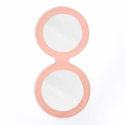 A pink PU mini pocket makeup mirror with two circular mirrors side by side.