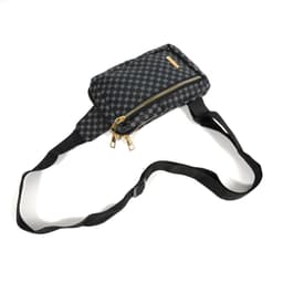 A black and grey checkered PU leather chest pack with a zippered compartment and an adjustable strap.