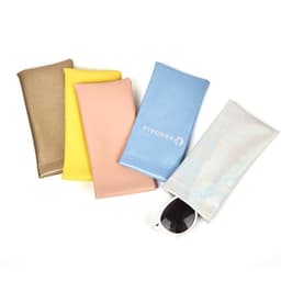 A selection of PVC leather pouches in gold, yellow, pink, blue, and iridescent, with sunglasses partially visible in one.