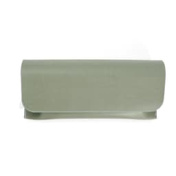 A PU flip top glasses case in a soft green colour with a sleek, minimalist design and a logo.