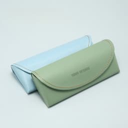 Two portable PU sunglasses cases in light blue and green, featuring curved edges and a branded logo.