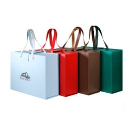 A set of four portable foldable gift boxes in blue, red, brown, and green, each with handles and a logo.