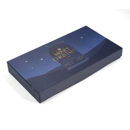 A decorative dark blue gift box featuring a "Merry Christmas" design with stars and a night scene.