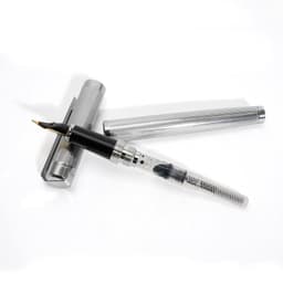 A silver fountain pen with a transparent ink converter and a matching cap rests on a white background.