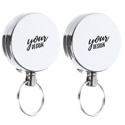 A retractable badge holder reel featuring a silver finish with a white circular casing and a keyring attachment.