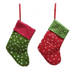 A Christmas stocking-shaped gift bag in green and red with sequined trim and snowflake patterns, featuring a logo.