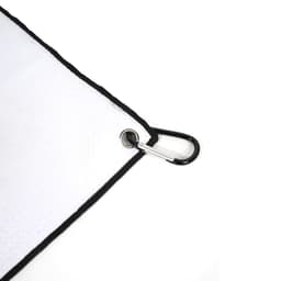 A white golf towel with a black trim and a carabiner clip attached. It features a small logo.