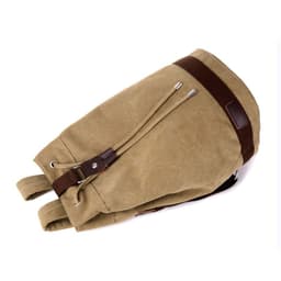 A khaki canvas drawstring backpack with brown leather accents and drawstrings. It has a logo on the side.