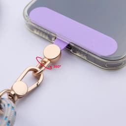 A lavender cell phone lanyard patch with a gold clasp features a 360-degree swivel connection.