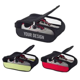 A portable zippered golf shoe bag in black, featuring mesh panels and available in red, yellow, and black.