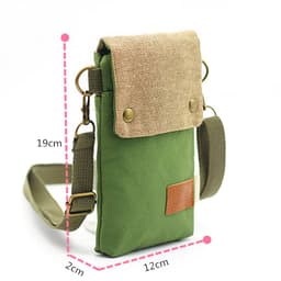 A green canvas shoulder bag with a tan flap, featuring an adjustable strap and a small brown patch.
