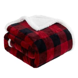 A folded double layer flannel blanket in red and black check pattern with a soft white fleece lining.
