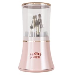 A rotating makeup brush holder in a sleek pink and gold design, featuring various makeup brushes inside.