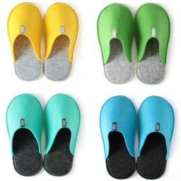 Four pairs of custom non-slip felt slippers in yellow, green, turquoise, and aqua, each featuring a logo.