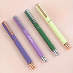A set of personalised ballpoint pens in purple, green, and yellow, featuring sleek designs and a logo.