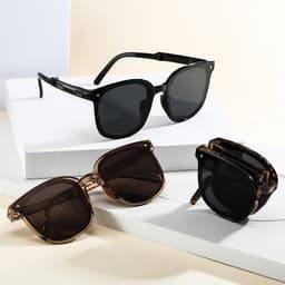 Three pairs of polarized folding sunglasses in black and brown hues displayed on a white surface.