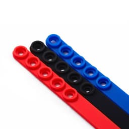 Custom adjustable silicone wristbands in red, black, and blue, featuring hole adjustment points and branding.