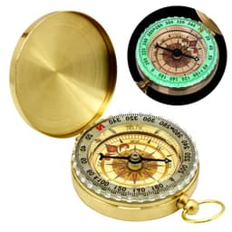 A brass portable compass with a luminous dial, featuring a decorative design and a hinged lid.