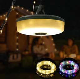 A portable camping string light in white and multicoloured options, hanging above a campsite scene.
