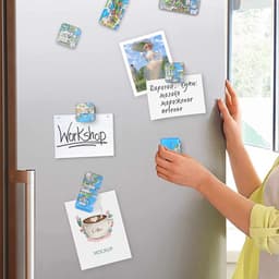 A variety of colourful motivational magnets attached to a silver refrigerator, holding notes and reminders.