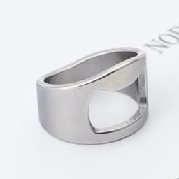 A drink bottle opener ring made of polished titanium steel, featuring a sleek, minimalist design.