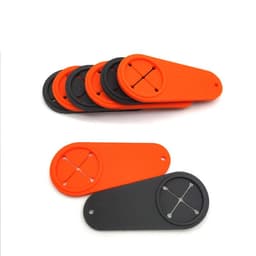 A set of golf towel holders in orange and black, featuring circular attachments for securing towels.