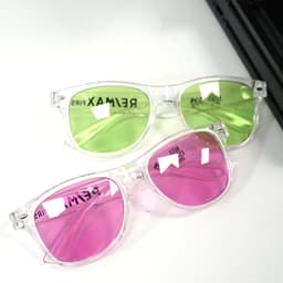Polarised transparent sunglasses with green and pink lenses, featuring a clear frame and a logo on the side.