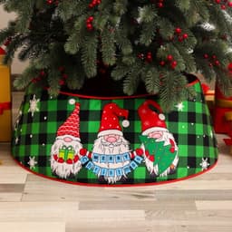 A festive Christmas tree skirt featuring three gnomes, with a green checkered pattern and red trim.