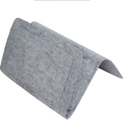 A grey felt bedside pocket with one large compartment and a folded design for easy placement.