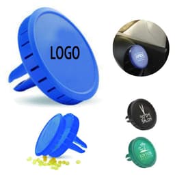 A blue clip-on car vent air freshener with a logo, accompanied by black and green variants and yellow freshening beads.