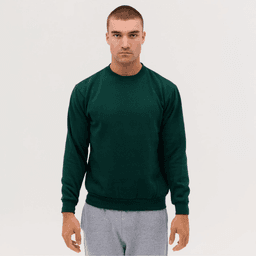 A green crew neck sweatshirt, worn by a model with a neutral expression, styled with grey sweatpants.