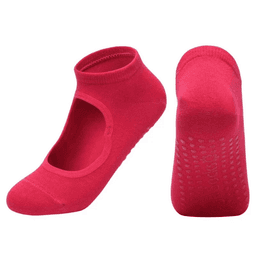 A pair of bright pink yoga socks with an open top and textured soles for grip. Features a logo on the side.