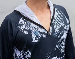 A 1/4 zip fishing hoodie in navy with a striking graphic design, featuring a hoodie and a branding logo.